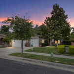 11733 Pactfield Pl single-story home for sale in Chapman Heights, Yucaipa at twilight — DeBonis Real Estate Team]