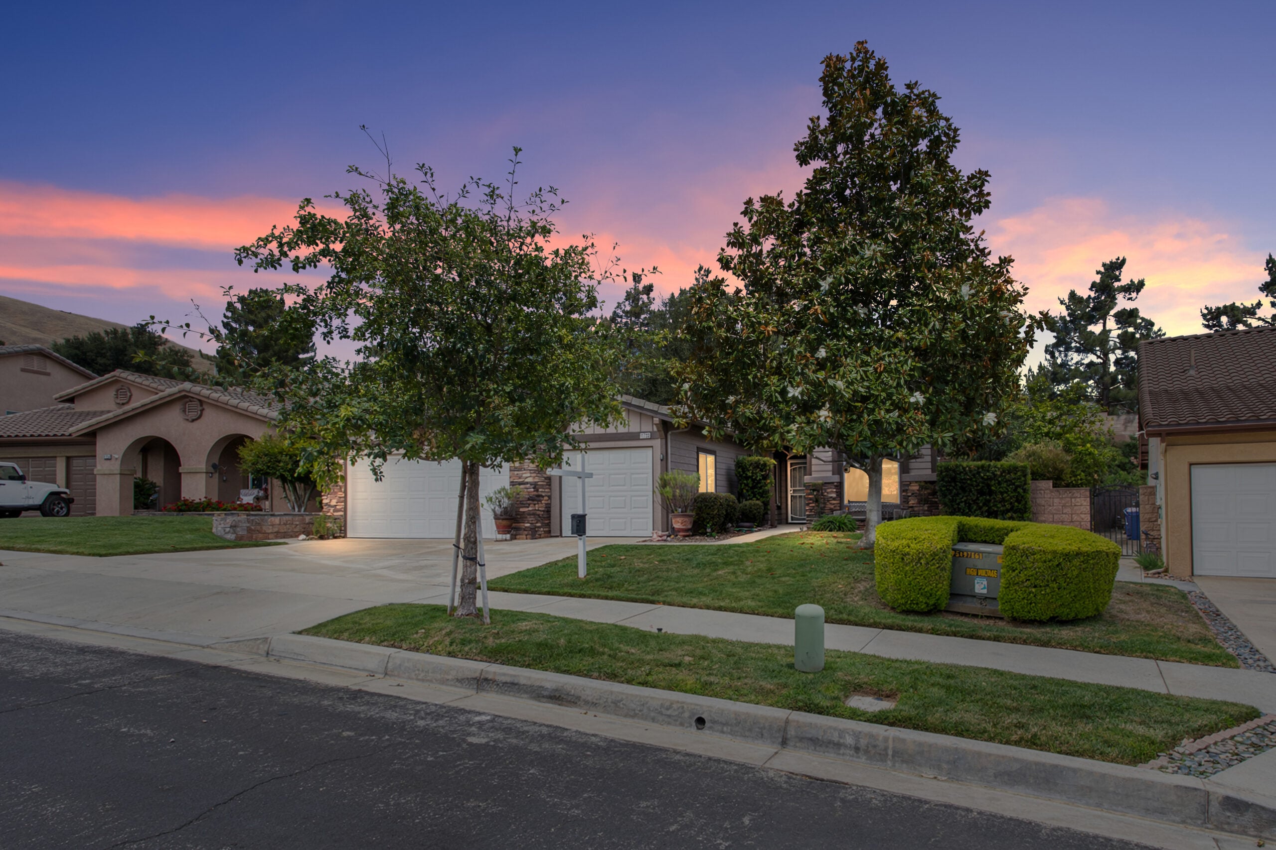 11733 Pactfield Pl single-story home for sale in Chapman Heights, Yucaipa at twilight — DeBonis Real Estate Team]