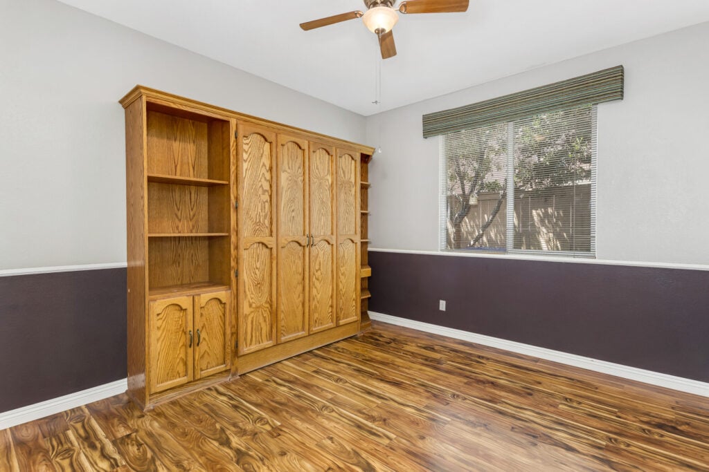 Den and office with built-in cabinetry, convertible to a fourth bedroom — DeBonis Real Estate Team]