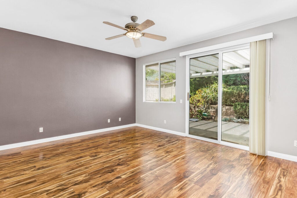 Primary suite with direct patio access — DeBonis Real Estate Team]