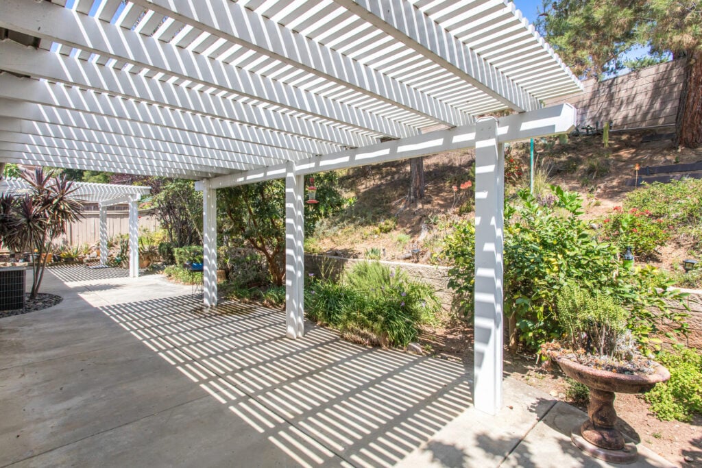 Covered patio with mountain views in Chapman Heights — DeBonis Real Estate Team]