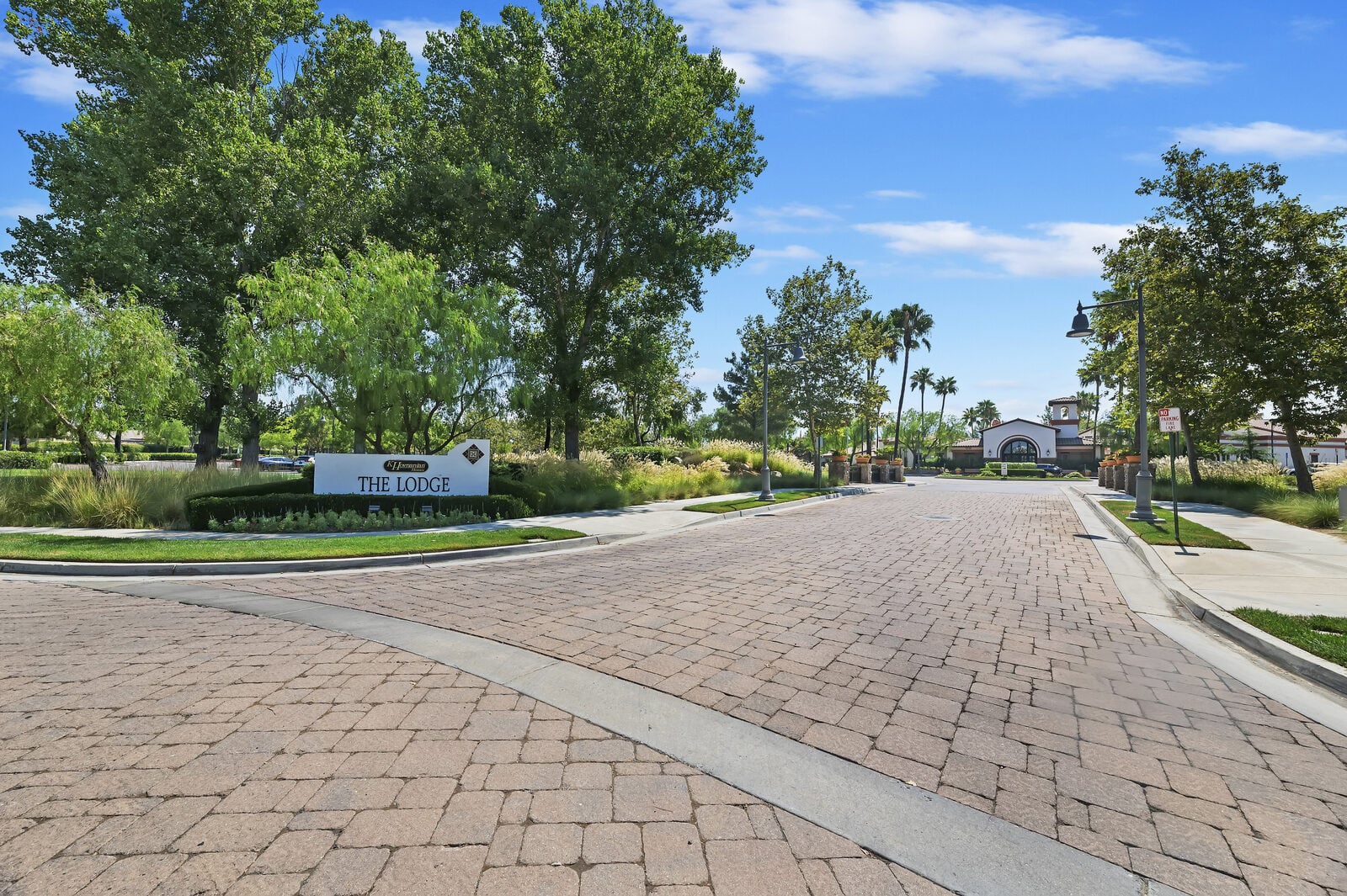 Paver entry drive and The Lodge monument sign at Four Seasons at Beaumont