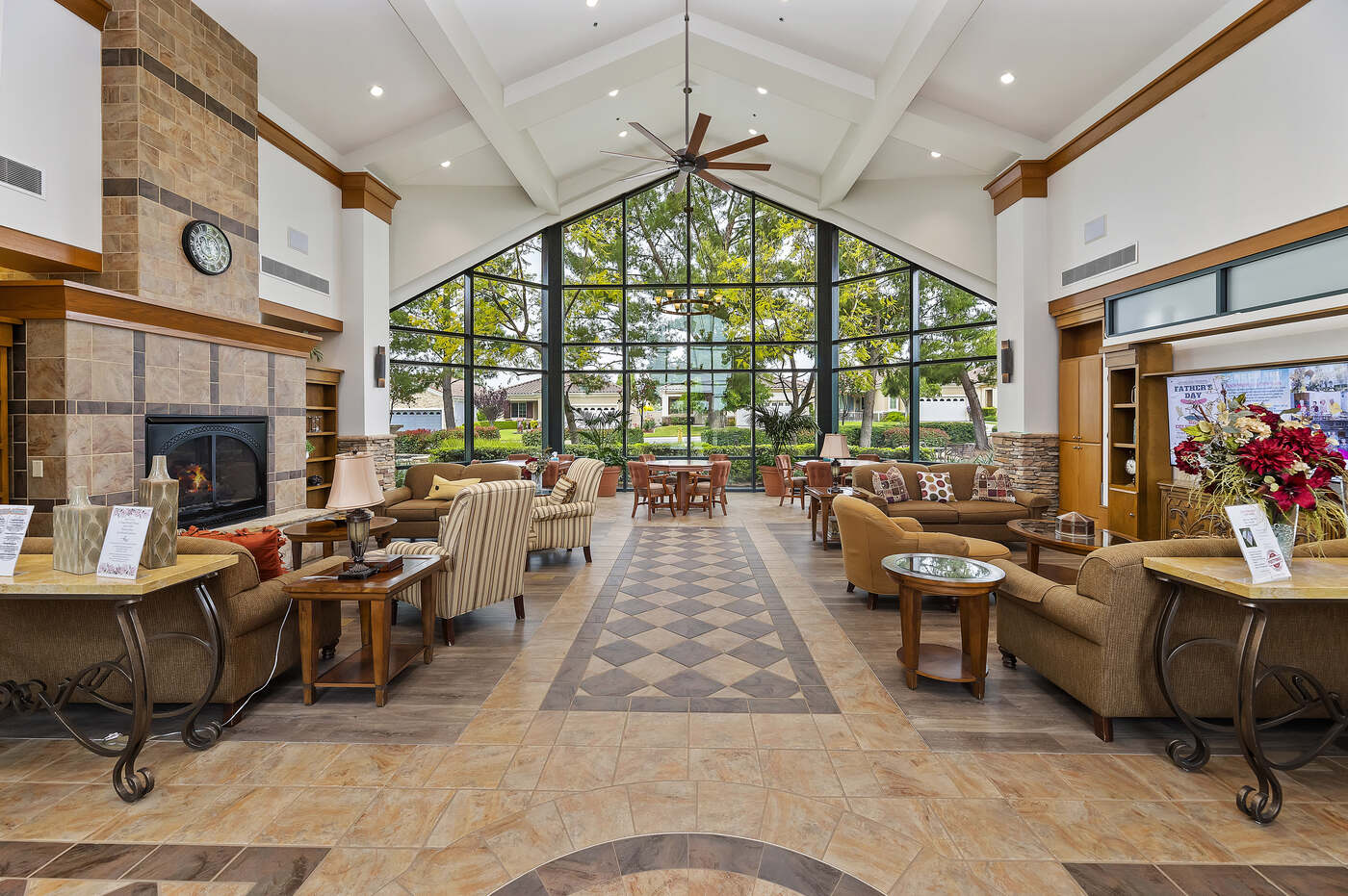 Great room with fireplace and vaulted ceiling inside the Oakmont Clubhouse at Solera at Oak Valley Greens