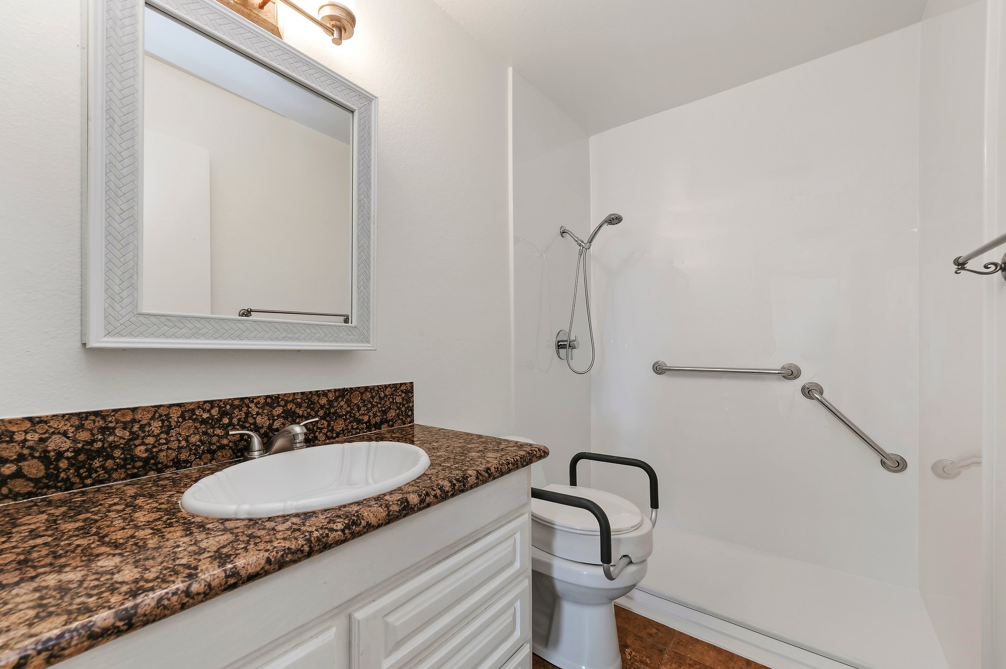 Bathroom with granite vanity and walk-in shower with grab bar | 1194 Border Ave #A, Corona