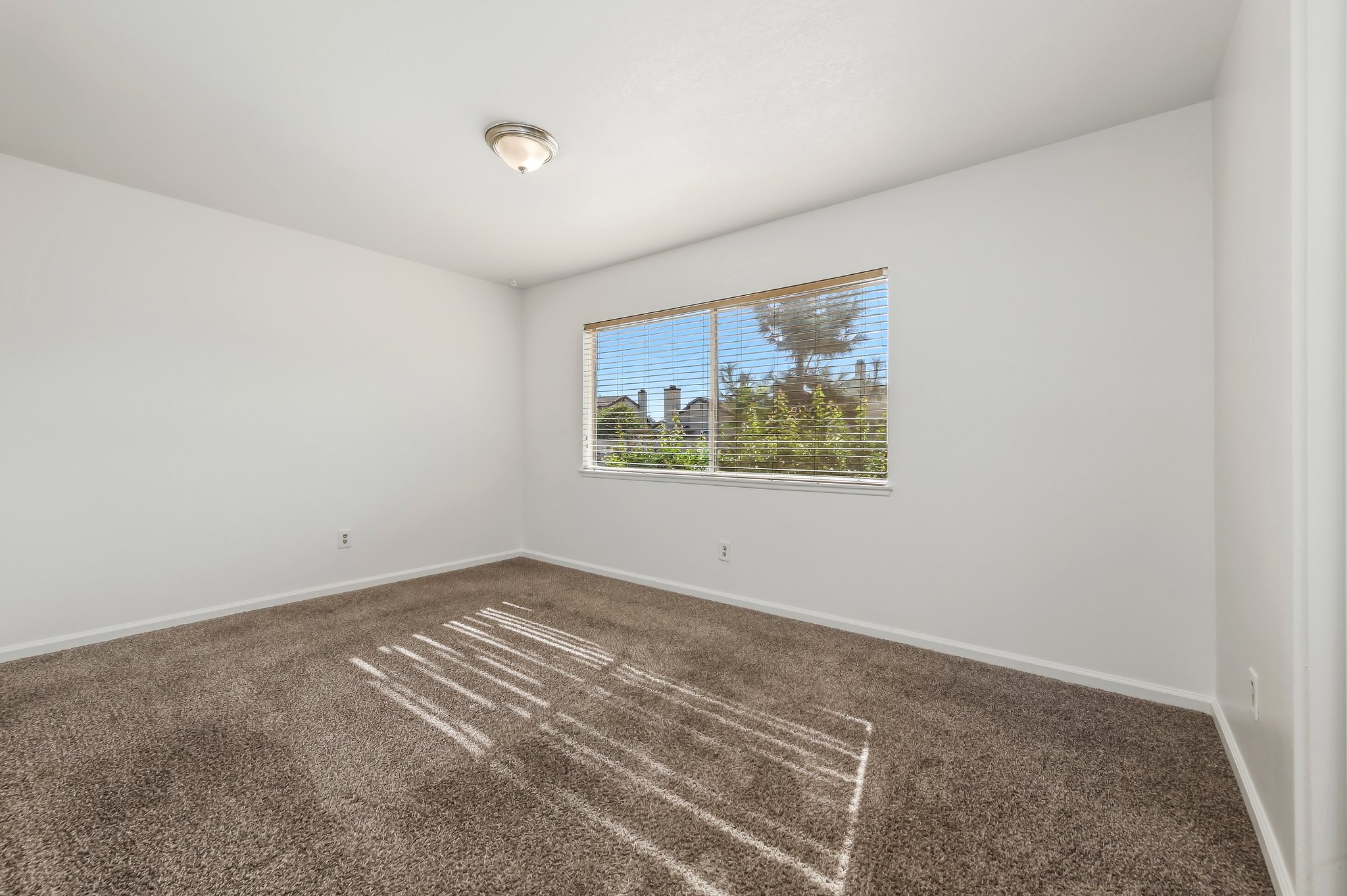 Carpeted bedroom with window | 1194 Border Ave #A, Corona