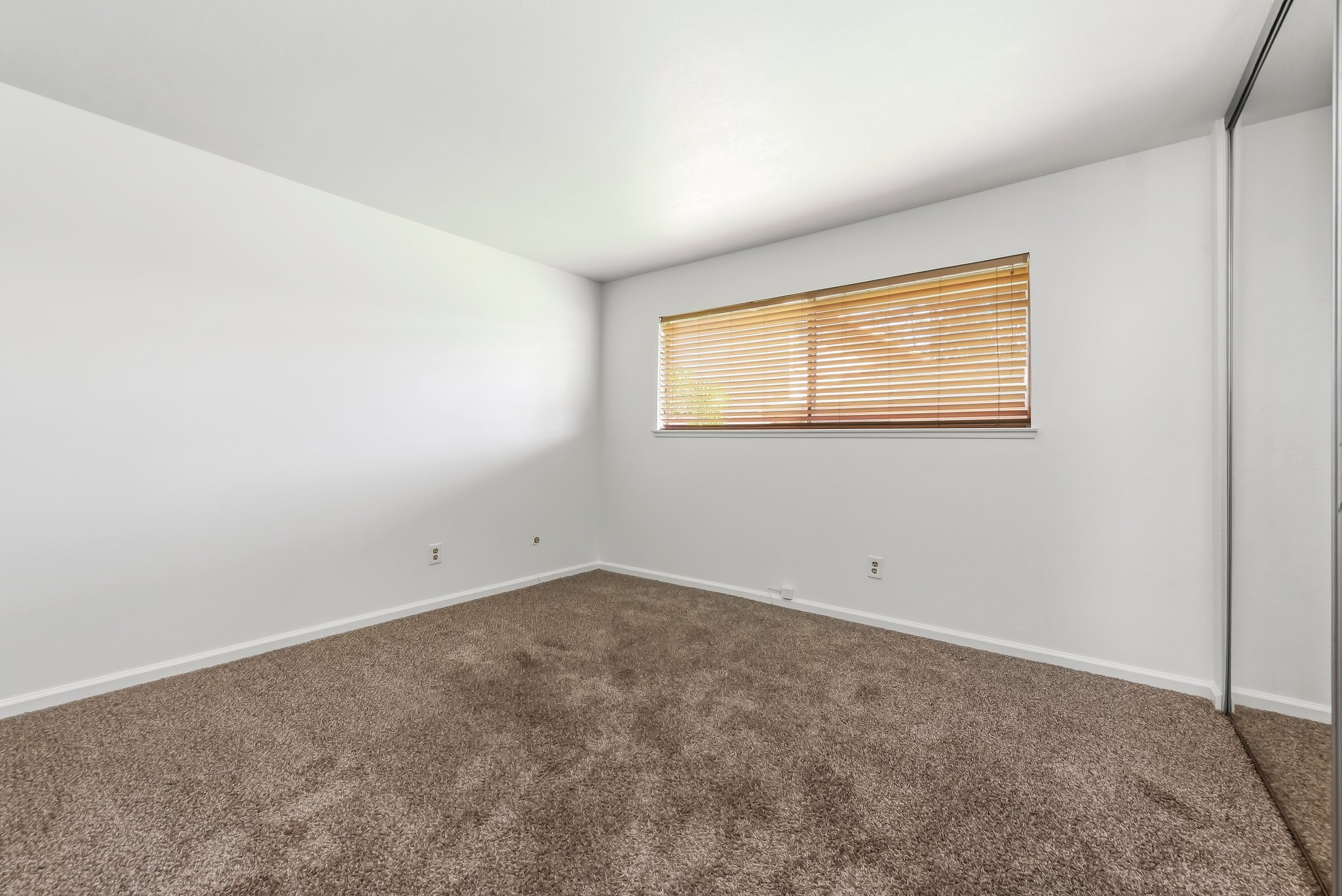 Bedroom with mirrored closet doors | 1194 Border Ave #A, Corona