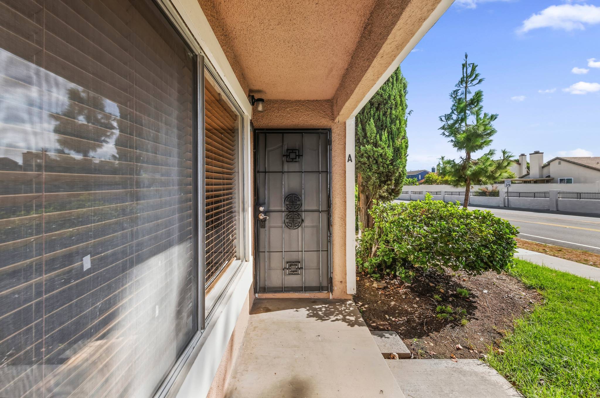 Front entry door with security screen door | 1194 Border Ave #A, Corona