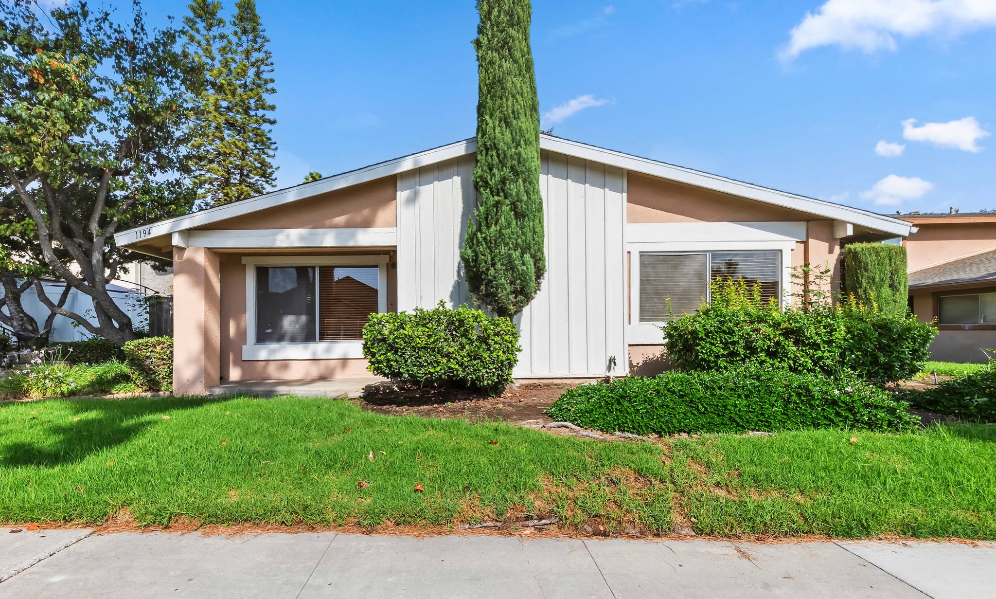 Front of the home with mature cypress trees | 1194 Border Ave #A, Corona