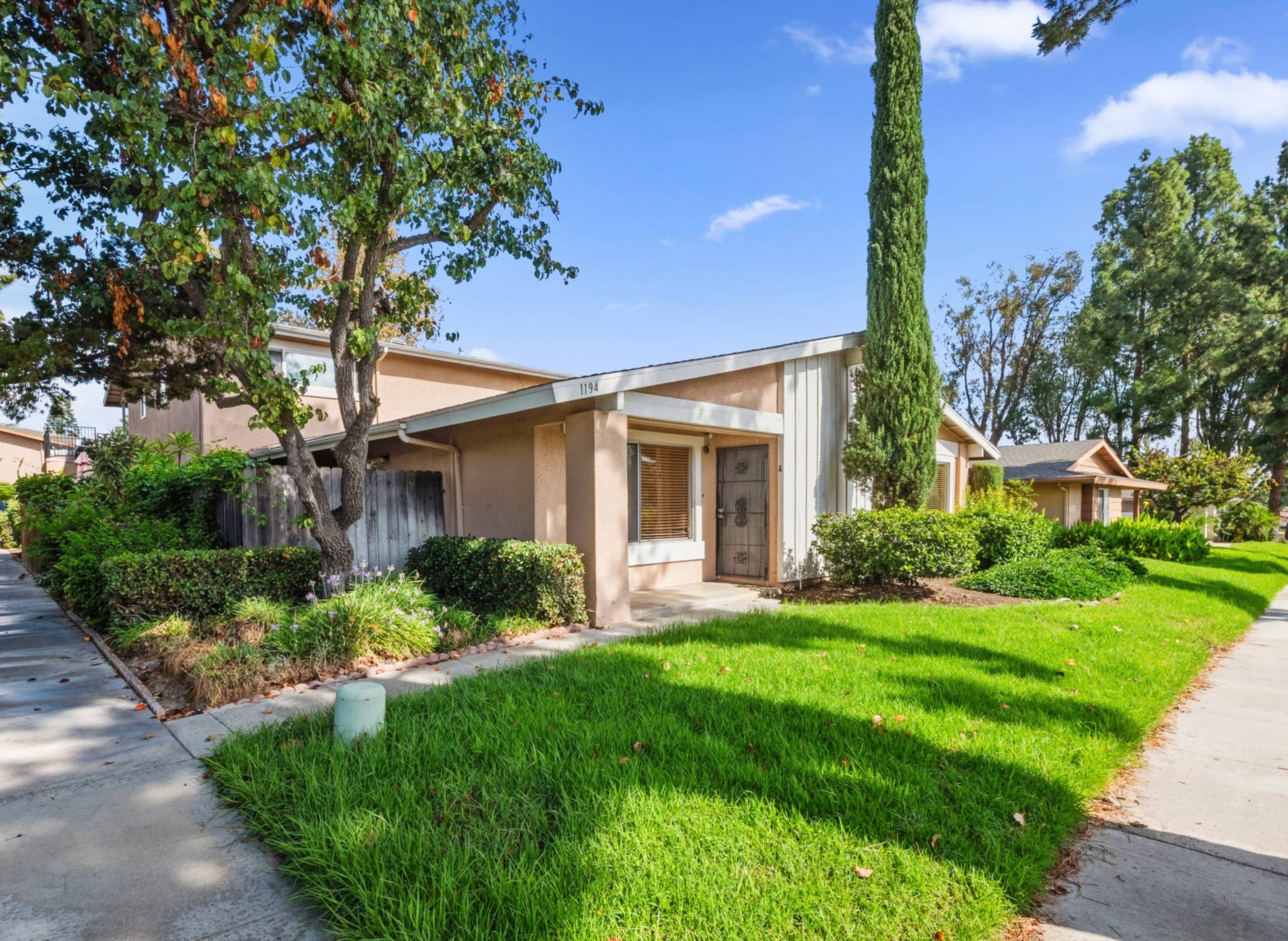 Front of the end-unit condo seen from the sidewalk | 1194 Border Ave #A, Corona