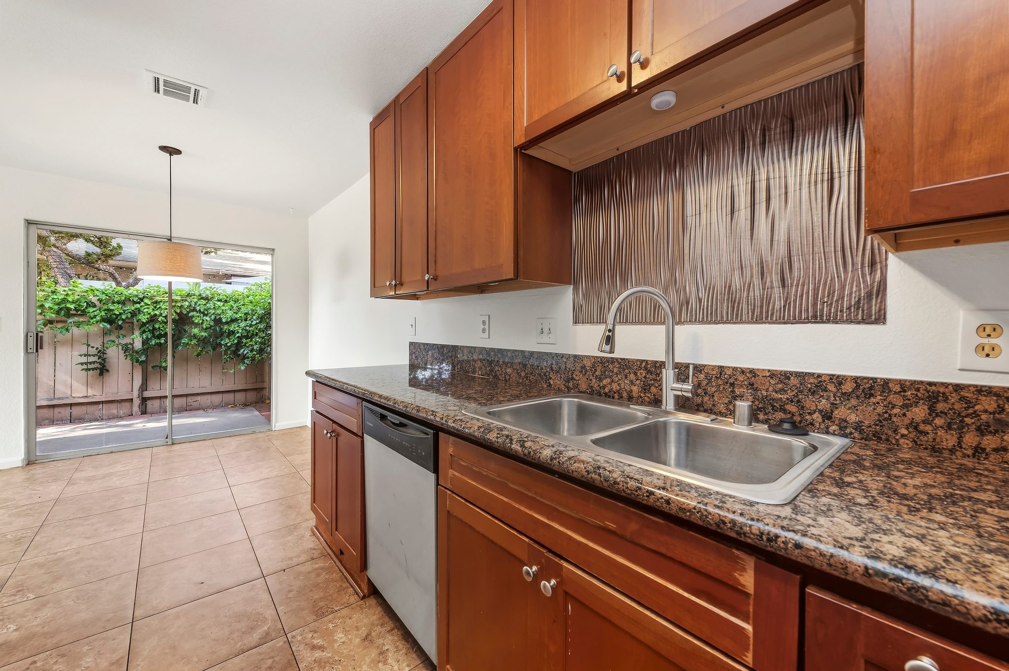 Kitchen sink with granite counters and dishwasher | 1194 Border Ave #A, Corona