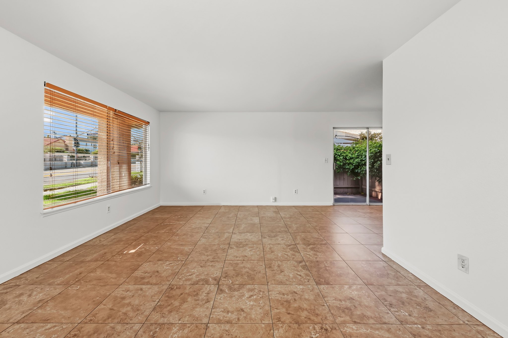 Living room with large windows and tile floors | 1194 Border Ave #A, Corona