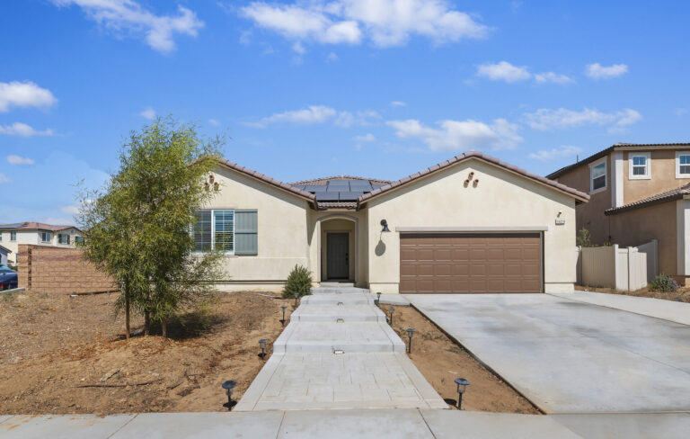 Front exterior of 14016 Liguria, a single-story home in Olivewood, Beaumont