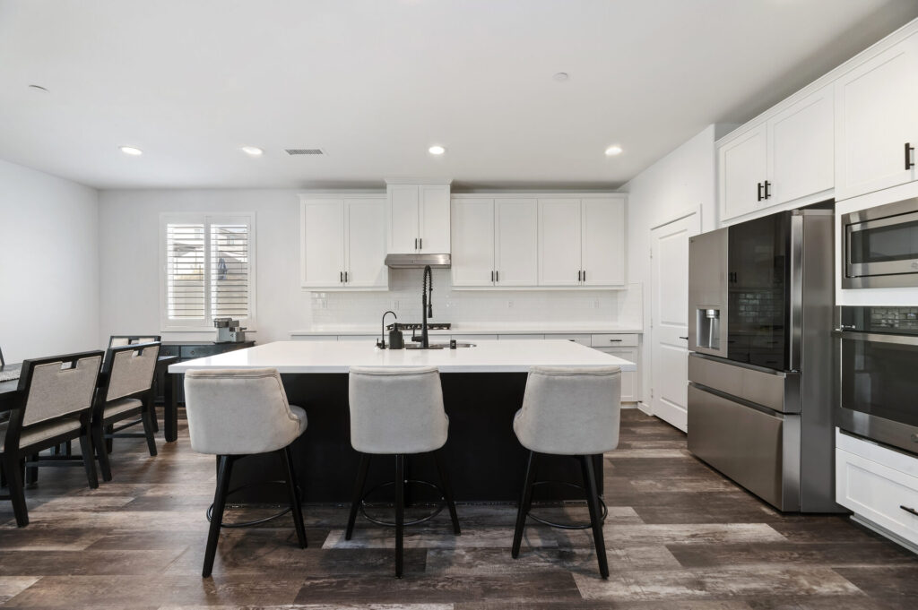 Quartz kitchen island with white cabinetry