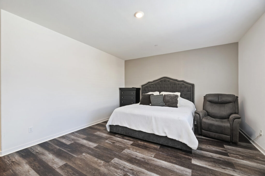 Primary bedroom with window shutters