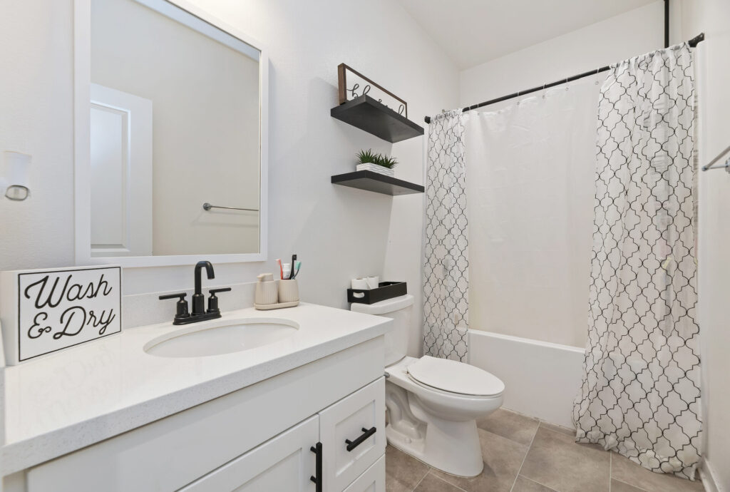Secondary bathroom with a tub and shower