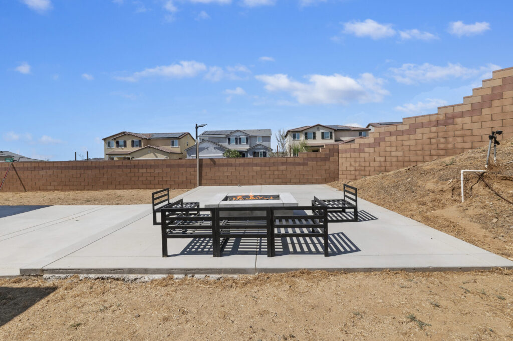 Custom gas fire pit and seating on the patio