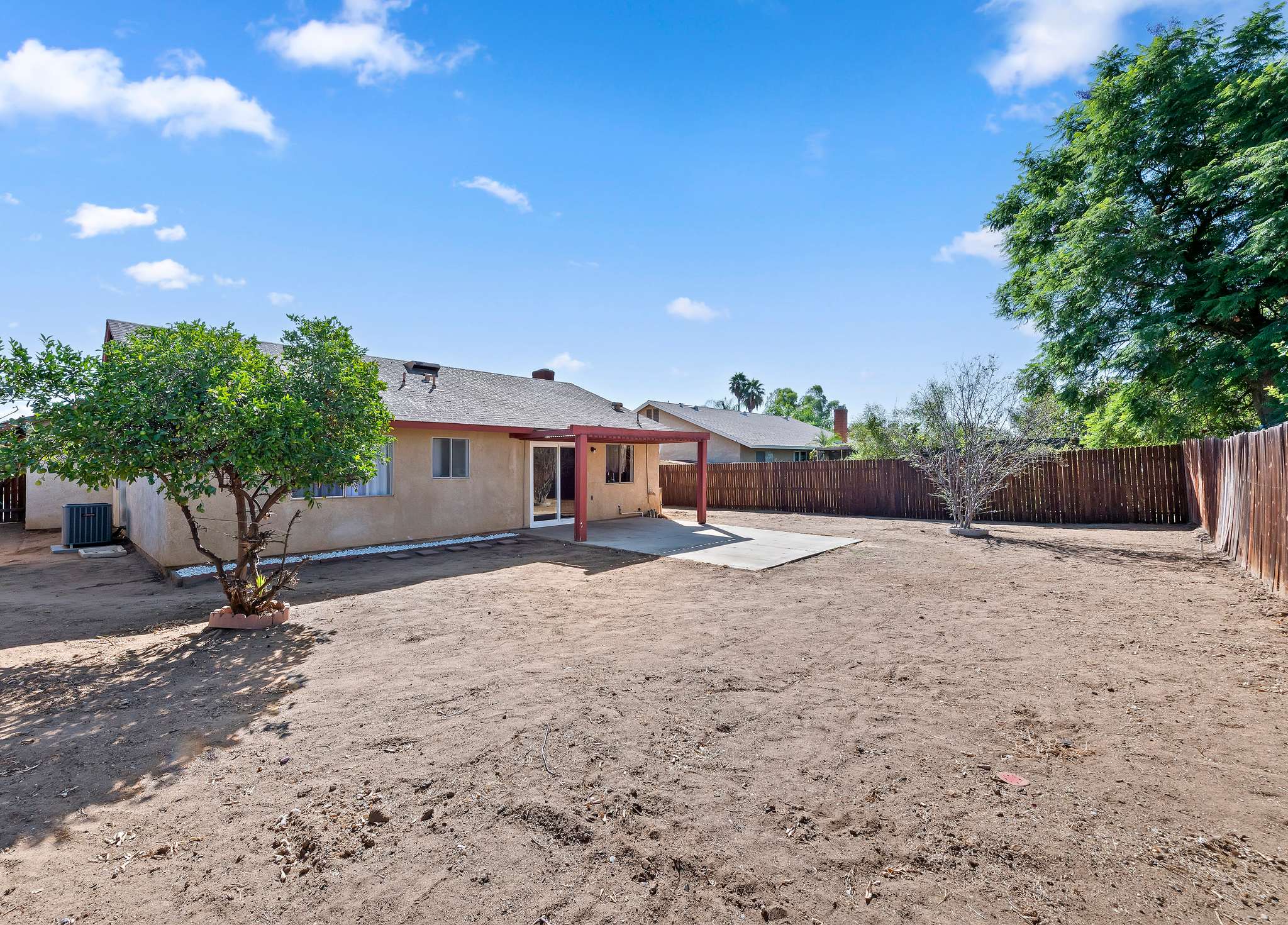 Backyard and side yard behind the house | 14927 Wintergreen St, Moreno Valley