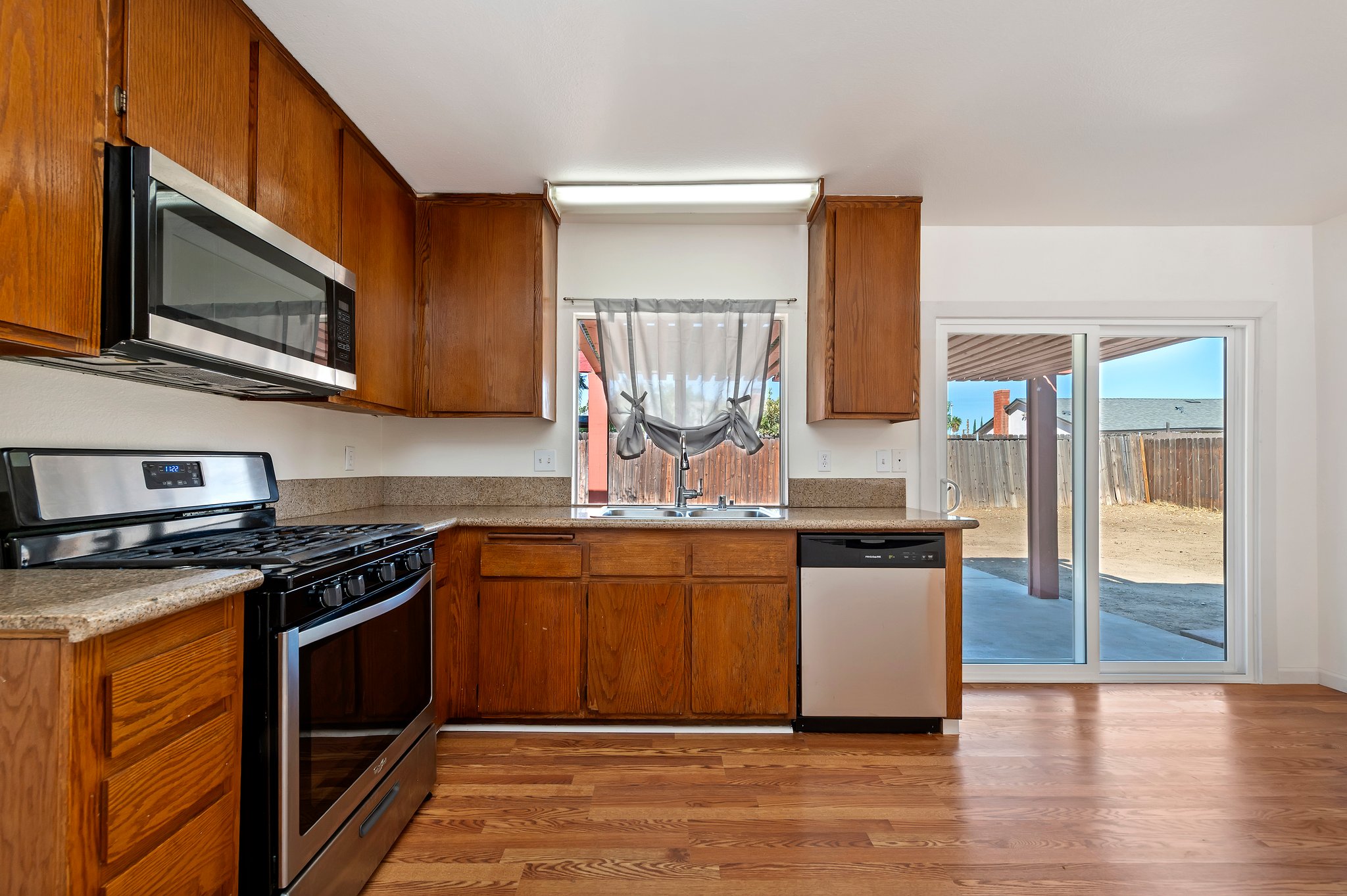 Stainless gas range and microwave in the kitchen | 14927 Wintergreen St, Moreno Valley