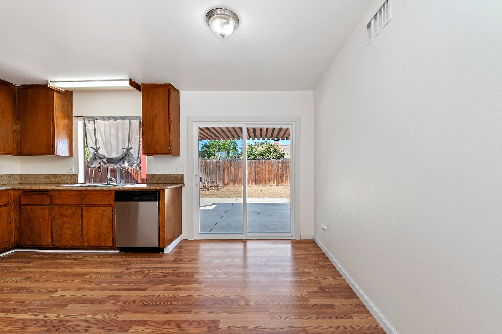 Kitchen with granite counters, sink and window | 14927 Wintergreen St, Moreno Valley