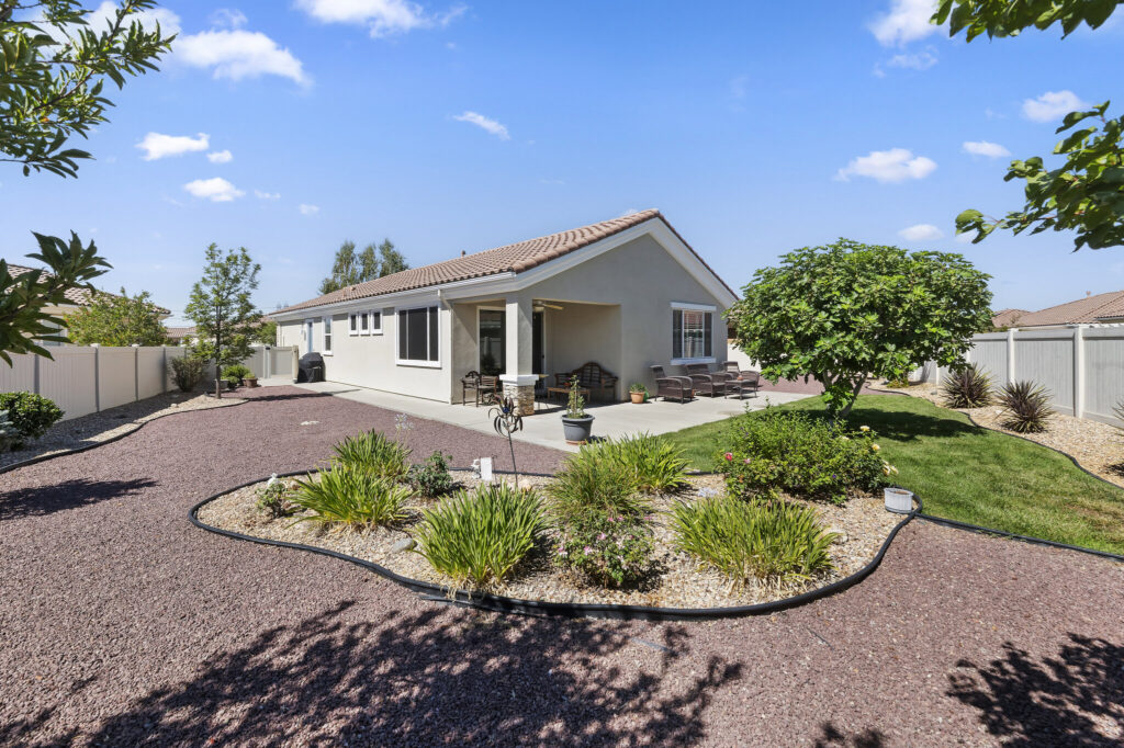 1142 Wisteria Way, Beaumont — landscaped backyard with fruit trees