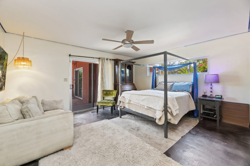 1717 Terrace Dr, Hemet — bedroom with ceiling fan and sliding door to the patio