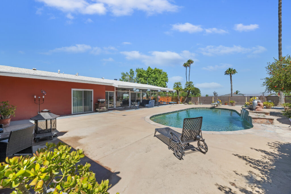 1717 Terrace Dr, Hemet — pool and rear of the home with covered patio