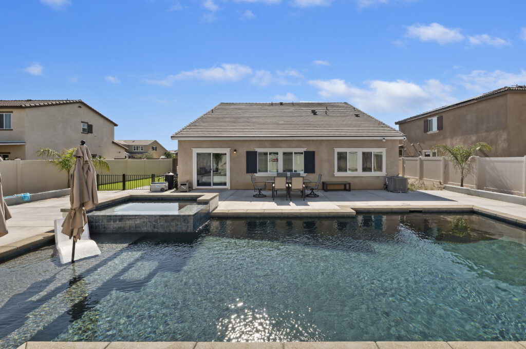 2153 El Nido Ave, Perris — pool, raised spa and patio along the rear of the home