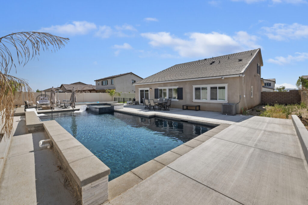2153 El Nido Ave, Perris — custom pool and spa with lounge deck in the fenced backyard