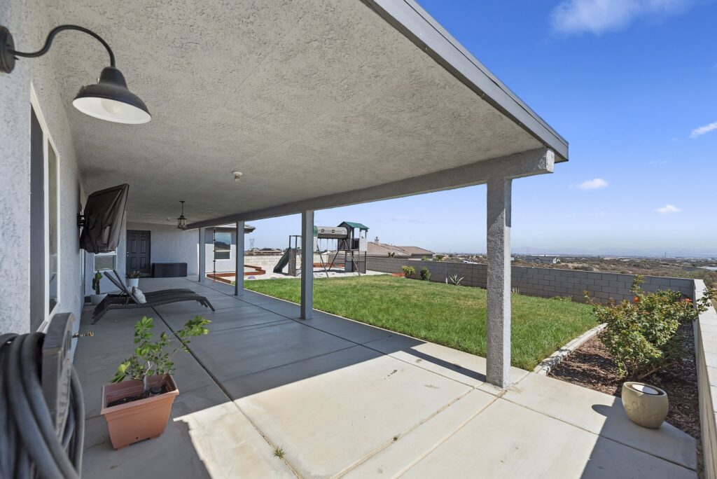 7122 Braceo St, Oak Hills — covered patio looking out to the lawn