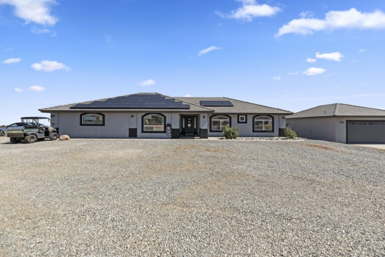 7122 Braceo St, Oak Hills — front of the home with the detached garage and RV workshop